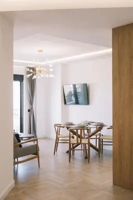 a dining room with a table and chairs at Azanti Residence in Ulcinj