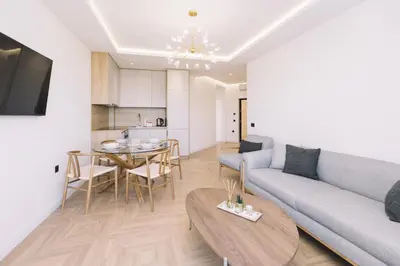 a living room with a couch and a table at Azanti Residence in Ulcinj