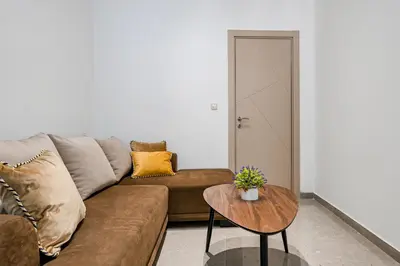 a living room with a couch and a table at Old Town Lux in Kotor
