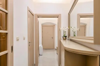a bathroom with a large mirror and a sink at Old Town Lux in Kotor