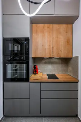 a kitchen with a stove top oven and a microwave at Old Town Lux in Kotor