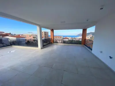 an empty living room with a view of a city at Vila Enesa in Dobra Voda