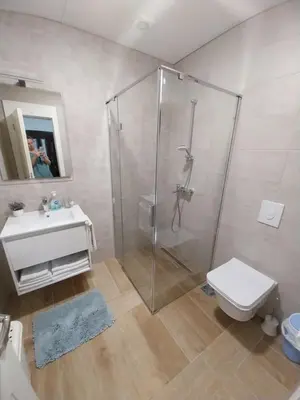 a bathroom with a shower and a toilet and a sink at Jon in Ulcinj