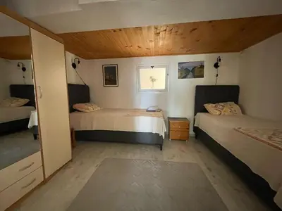 a bedroom with two beds and a window at Apartment Luna in Ulcinj