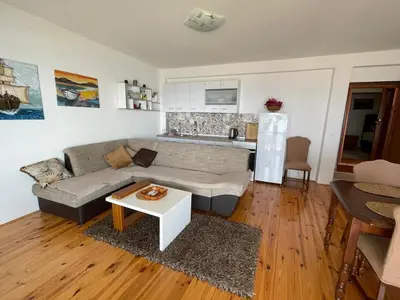 a living room with a couch and a table at Apartment Luna in Ulcinj