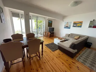 a living room with a couch and a table at Apartment Luna in Ulcinj