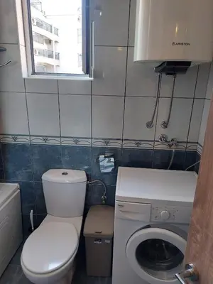 a small bathroom with a toilet and a sink at Goran in Budva