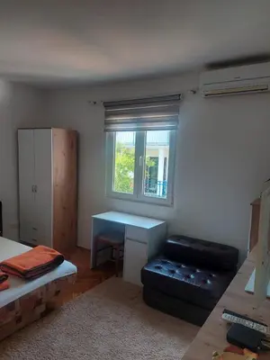a small room with a desk and a window at Goran in Budva
