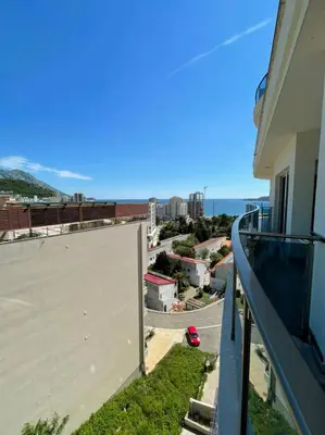 a balcony of a building with a view of a street at Apartment WaveSea in Becici