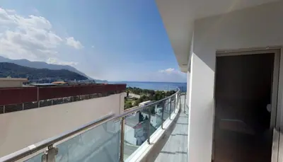 a balcony of a building with a view of the ocean at Apartment WaveSea in Becici