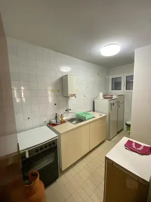a kitchen with a stove and a refrigerator at Kosta in Bar
