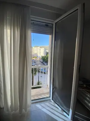 a large window with a view of a city at Kosta in Bar