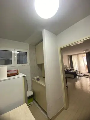 a room with a kitchen and a living room at Kosta in Bar