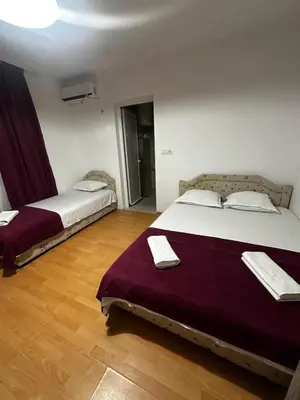 a bedroom with two beds in a room at Sara s Apartments in Ulcinj