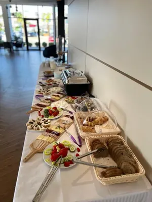 a long buffet line of food on a table at Hotel Adler in Ulcinj