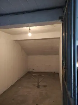 an empty room with a table in the middle at Apartment Elena in Prijevor