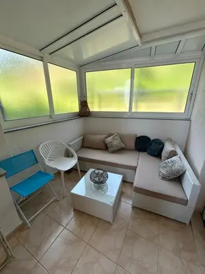 a living room with a couch and a table at Apartment Elena in Prijevor