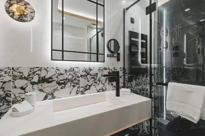 a bathroom with a sink and a mirror at Luminoso Boutique Hotel in Budva