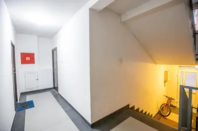 a room with a white wall and a bike leaned against a wall at Apartment Sole in Cetinje