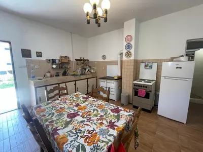 a kitchen with a bed in the middle of a room at The Viewpoint House - Njeguši in Njeguši