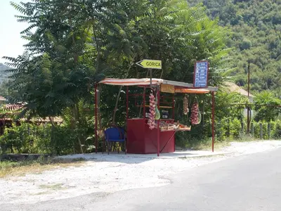 a fruit stand on the side of a road at Guesthouse Feel Lake in Virpazar