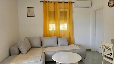a living room with a couch and a table at ValMar in Bar, Susanj