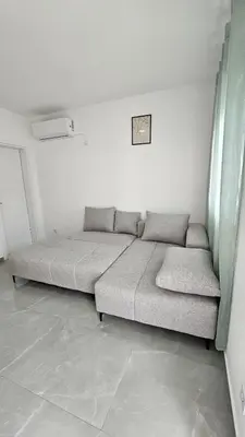 a bed in a white room with a bed frame at ValMar in Bar, Susanj