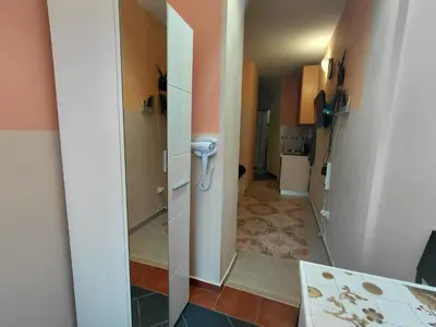 a hallway with a phone in a room at Black Cat Apartment in Budva