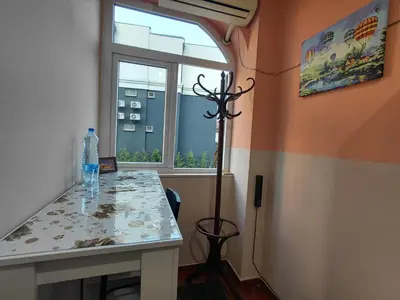 a dining room with a table and a window at Black Cat Apartment in Budva