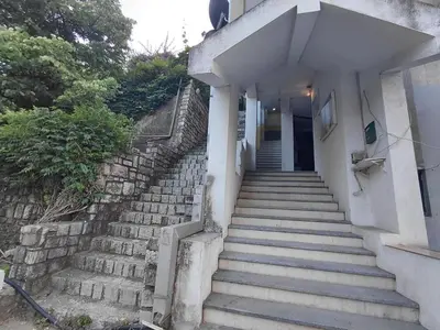 a set of stairs leading up to a building at Black Cat Apartment in Budva