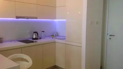 a white kitchen with a sink and a toilet at Apartment TC Lux VLSB in Budva