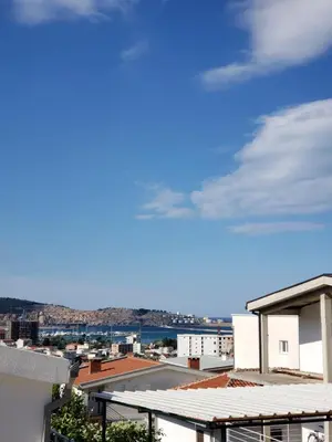 a view of a city from the roof of a building at Уютная 1-комнатная квартира с видом на море! in Bar
