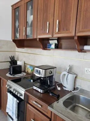 a kitchen with a coffee maker on a counter at Уютная 1-комнатная квартира с видом на море! in Bar