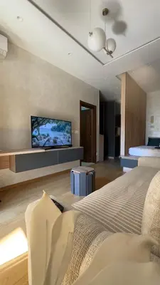 a bedroom with a bed and a flat screen tv at Studio 7-Budva in Budva