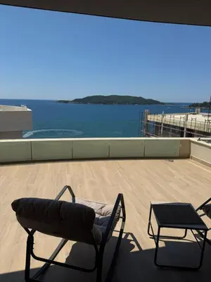 a chair and a table on top of a roof at Green Stone lamela B in Rafailovici