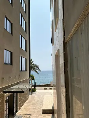 an external view of a building with the ocean in the background at Green Stone lamela B in Rafailovici