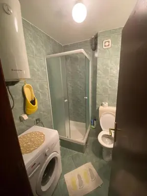 a bathroom with a shower and a toilet and a sink at Apartment Lima in Kotor