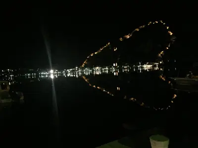 a view of a roller coaster at night at Apartment Lima in Kotor