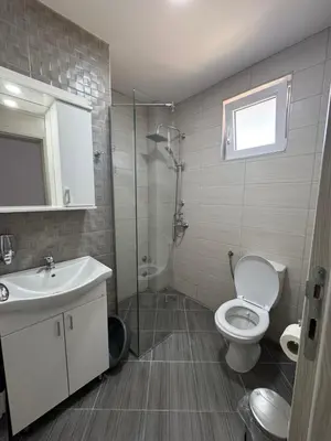 a bathroom with a toilet and a sink and a shower at Open Sky Montenegro in Utjeha