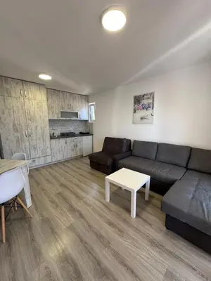 a living room with a couch and a table at Open Sky Montenegro in Utjeha