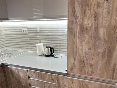 a kitchen with a counter with a candle on it at Apartman T&T in Cetinje