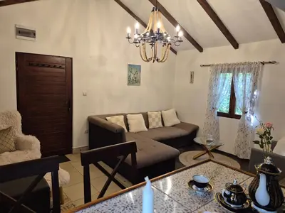 a living room with a couch and a table at Castio del Monte Winery & Resort in Petrovac na Moru