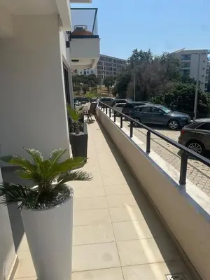 a balcony with plants on the side of a building at Ars Dobra Voda in Dobra Voda