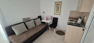 a small living room with a couch and a table at Apartments Plaza in Ulcinj
