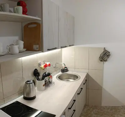 a kitchen with a sink and a counter top at Tea23 in Kotor