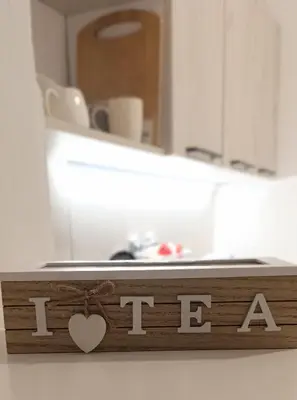a wooden sign with the word i love in front of a mirror at Tea23 in Kotor