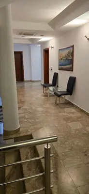 a waiting room with chairs and a painting on the wall at Hotel Porto Otrant in Ulcinj
