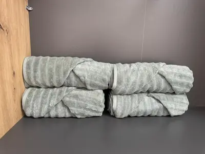 a stack of towels sitting on the floor at LazArina Apartments in Bar