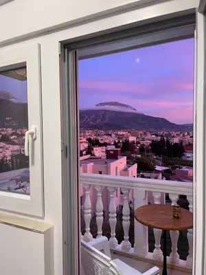 a view of a city from a balcony at LazArina Apartments in Bar
