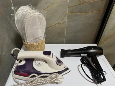 a hair dryer sitting on a counter with a hair dryer at LazArina Apartments in Bar